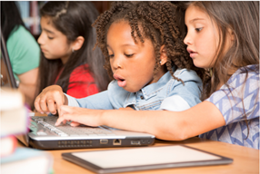 Children working together on a laptop